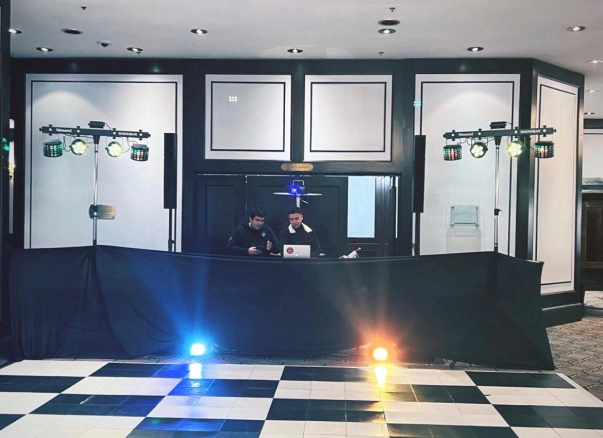 MCL and a fellow DJ at a corporate event booth