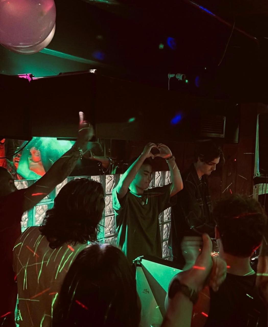 Crowd making heart hands during an MCL set